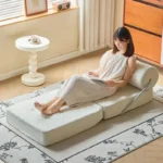 Goldoma Folding Lazy Sofa Chair in modern living room with corduroy or leather upholstery, small space