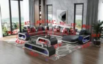 Goldoma genuine leather sectional sofa with LED lighting, storage shelves, USB ports, and cup holders in a modern living room