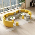 Goldoma modern S-shape PU leather modular sectional sofa set in an office lobby