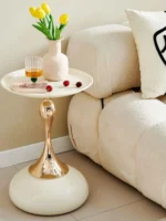 Goldoma modern side table with light grey iron frame placed in a living room corner