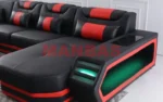 Goldoma genuine leather sectional sofa with LED lighting, storage shelves, USB ports, and cup holders in a modern living room