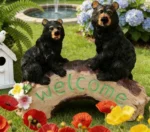 Top-down view of the bear family welcome sign statue, showing the arrangement of the mother bear and two cubs.