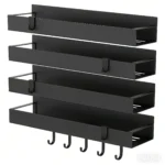 Black magnetic spice rack attached to refrigerator side, holding spice jars neatly organized