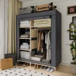 Goldoma freestanding fabric wardrobe with 6 storage areas, portable closet with shelves and hanging rail in a bedroom