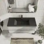 Vanity's open shelving and soft-close drawers, displaying storage capacity, in a well-lit bathroom.