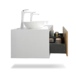 Close-up of the white vanity's marble countertop and undermount rectangular sinks, with chrome faucet handles, showing
