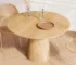 Solid wood dining table in natural oak finish, round 43 inch, placed in a modern dining room with chairs