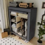 Goldoma freestanding fabric wardrobe with 6 storage areas, portable closet with shelves and hanging rail in a bedroom