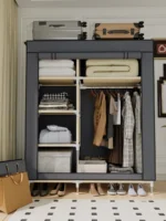 Goldoma freestanding fabric wardrobe with 6 storage areas, portable closet with shelves and hanging rail in a bedroom