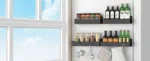 Black magnetic spice rack attached to refrigerator side, holding spice jars neatly organized