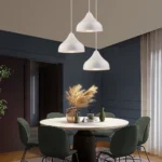 Living room scene with the pendant lamp as a focal point above a coffee table.