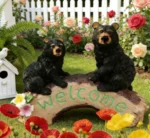 Side angle of the black bear resin statue highlighting its size and the intricate details of the bears' faces.
