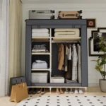 Goldoma freestanding fabric wardrobe with 6 storage areas, portable closet with shelves and hanging rail in a bedroom