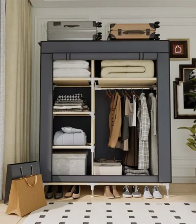 Goldoma freestanding fabric wardrobe with 6 storage areas, portable closet with shelves and hanging rail in a bedroom