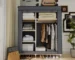 Goldoma portable wardrobe closet with 6 storage areas in a bedroom setting