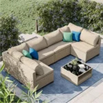 Modern outdoor patio sofa set with cushions in a backyard garden setting