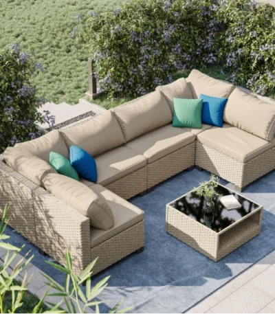 Modern outdoor patio sofa set with cushions in a backyard garden setting