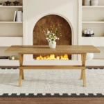 Modern square MDF wood dining table with X-shaped metal base in a dining room setting
