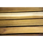 Brown teak bath mat with non-slip slats in a modern bathroom