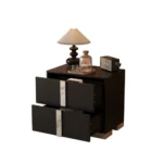 Modern mirrored nightstand with mirrored drawer front and metal legs in a bedroom setting