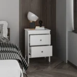 Modern white nightstand with two drawers beside a bed in a contemporary bedroom