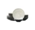 Elegant dinnerware set with white minimalist plates arranged on a wooden table