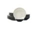 Elegant dinnerware set with white minimalist plates arranged on a wooden table