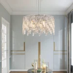 Close-up of polished chrome finish and faceted crystal droplets on a 9-light pendant chandelier, showing intricate