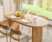 Modern extendable dining table with removable leaves set in a bright dining room