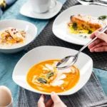 Elegant 50-piece porcelain tableware set by MALACASA Elisa series on a dining table