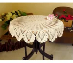 Vintage lace table mats in shabby chic style on a wooden table