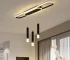 62W modern dimmable LED chandelier in black with three acrylic pendant lights over a kitchen island.