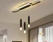 62W modern dimmable LED chandelier in black with three acrylic pendant lights over a kitchen island.
