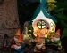 Solar garden gnome glowing at night in a flower bed