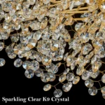 Luxury crystal chandelier illuminating a grand hotel lobby with sparkling K9 crystals