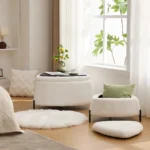 White faux fur storage ottoman set of 2 with metal legs placed in bedroom as footrest and shoe changing stool