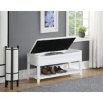 White storage bench with padded seat and shoe shelf in entryway