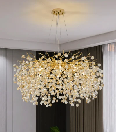 Modern crystal chandelier tree branch design illuminating a dining room