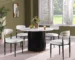 Modern round dining table for 4 with faux marble top and gold wave base in a bright dining room