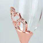 Elegant crystal champagne glasses set on a table with sparkling wine