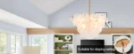 Vintage gold chandelier hanging over a dining table with warm glow