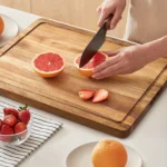Extra large chopping board with juice groove on kitchen counter