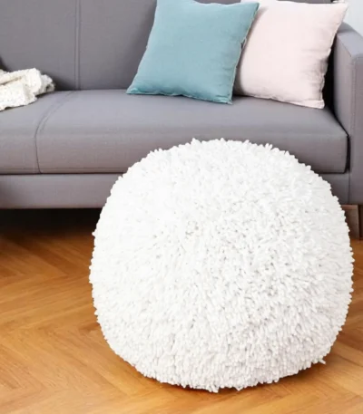 Goldoma cream cotton tufted pouf ottoman - round footrest and extra seat with tufted design