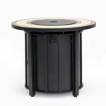 Outdoor gas fire pit column with blue flames on patio