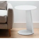 White aluminum outdoor side table with foldable legs and rounded granite finish placed on a patio