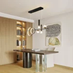 Dimmable LED pendant light installed in a dining room, illuminating a wooden table