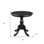 30 inch round dining table with black pedestal base in a modern dining room