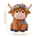 Highland cow garden statue with glowing solar light at dusk, surrounded by flowers