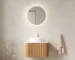 24-inch floating bathroom vanity with curved striped edges, white round ceramic basin, and natural woodgrain finish,