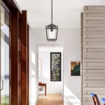 Close-up of the iron black pendant light showing textured cage design and matte finish.